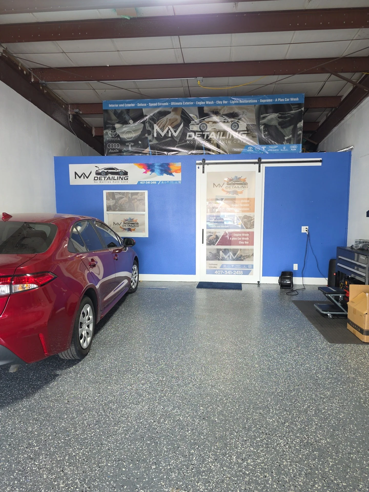 MV Detailing shop floor with branding